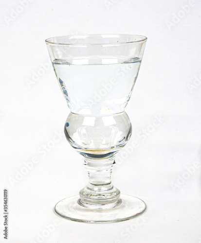 Glass of clear and fresh water islated on white
