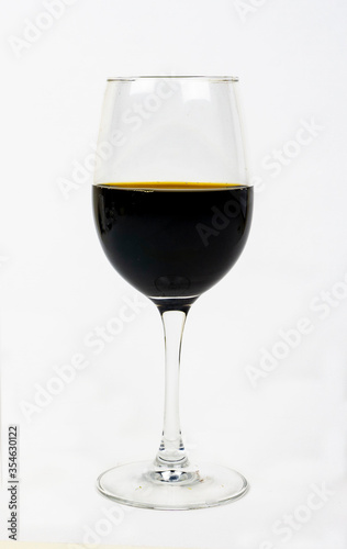 Glass of red wine isolated on white