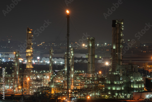 Aerial view by drone of oil petrochemical refinery plant during sunset time