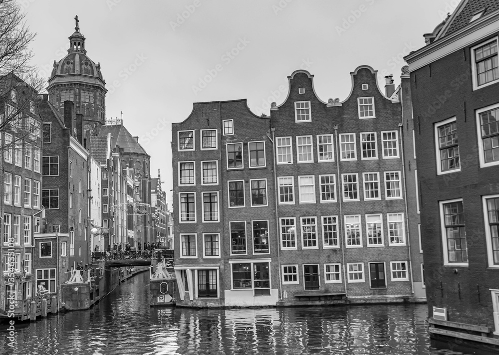 Fototapeta premium Amsterdam, traditional buildings on the water