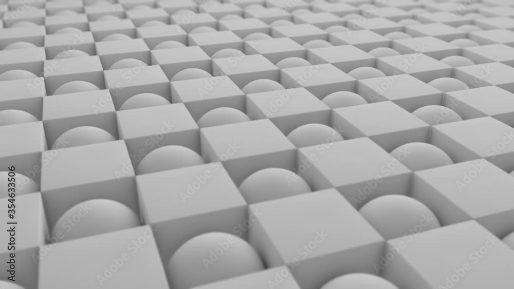 Abstract 3D animation of a geometric background of many spheres and cubes in a staggered order. Cubes turn into spheres and spheres turn into cubes. 4K seamless animation. Abstract 3D animation of a geometric background of many spheres and cubes in a staggered order. Cubes turn into spheres and spheres turn into cubes. 4K seamless animation.