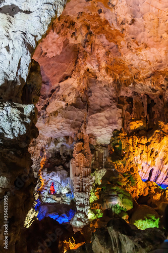 Stalactite and stalagmite formations in a limestone cave of Halong Bay, Vietnam