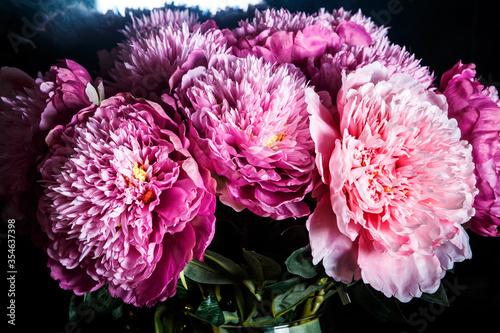 closeup beautiful bouquet made from many large pink and purple peonies