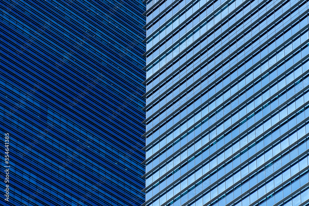 Obraz premium High glass skyscrapers on the streets of Singapore. Office windows background, closeup