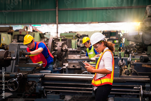 Engineers and technicians are solving problems caused by machines in industrial plants. © Thirawatana