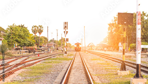 Railroad tracks in the countryside when the sun is about to fall photo