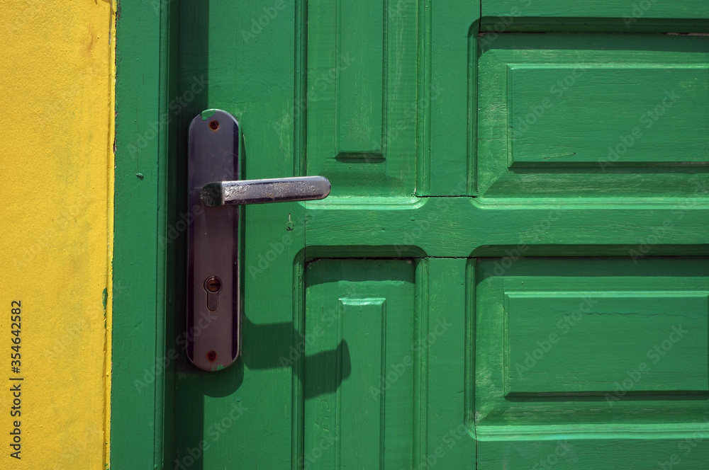 light green door with metal handle light green door with metal handle