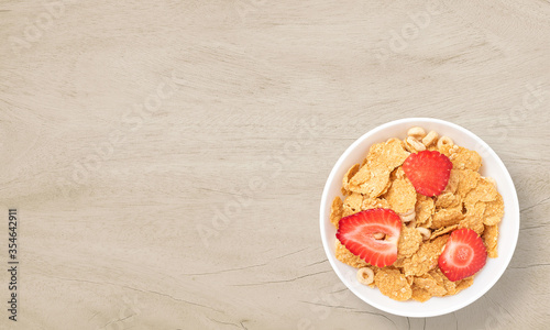 Cereal in a bowl on a wooden background