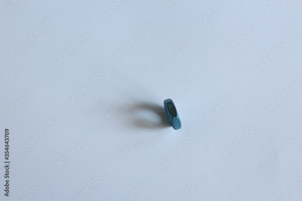 blue nut on a white table blue nut on a white table