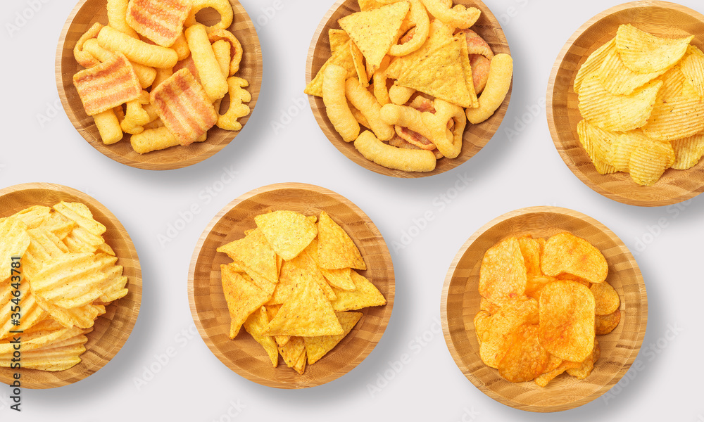 Crisps in a wooden bowl on a white background Crisps in a wooden bowl on a white background