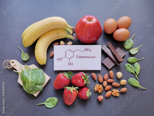 Foods rich in dopamine with structural chemical formula of dopamine molecule. Assortment of healthy food for good mood and happiness. Dopamine-boosting foods.