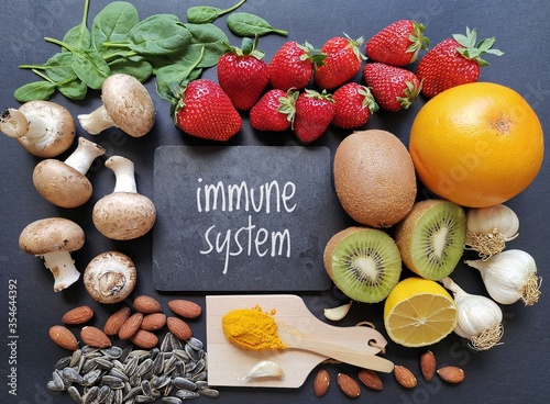 Assortment of food to naturally boost immune system. Immune-boosting foods. Concept of helpful ways to strengthen immunity naturally. photo