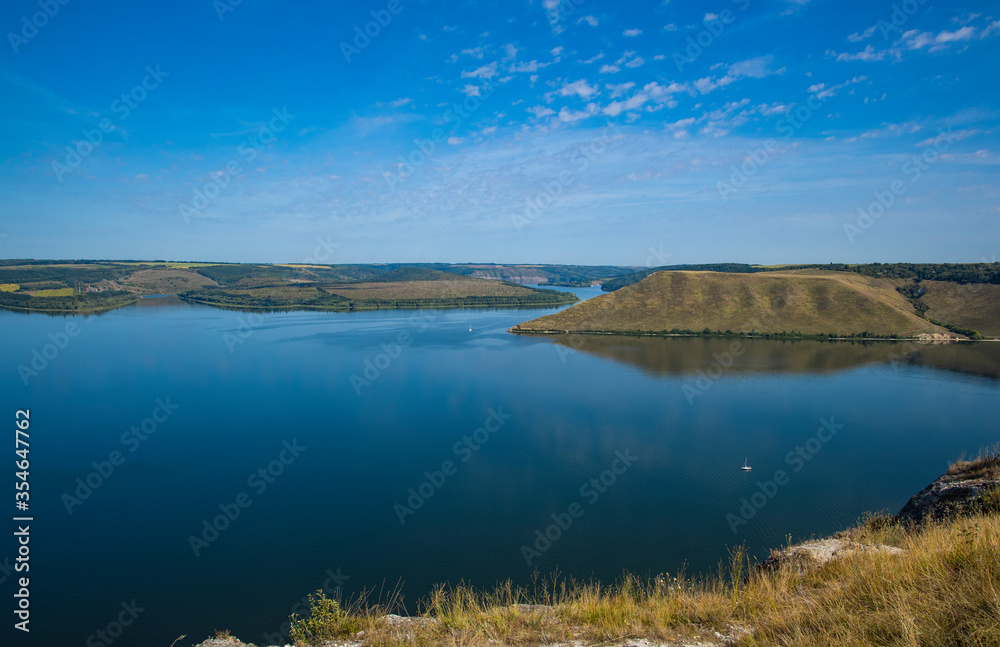 scenery view lake waters and hills summer morning time aerial landscape from above