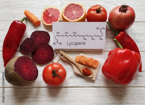 Bild auf Leinwand Foods rich in lycopene with structural chemical formula of lycopene molecule