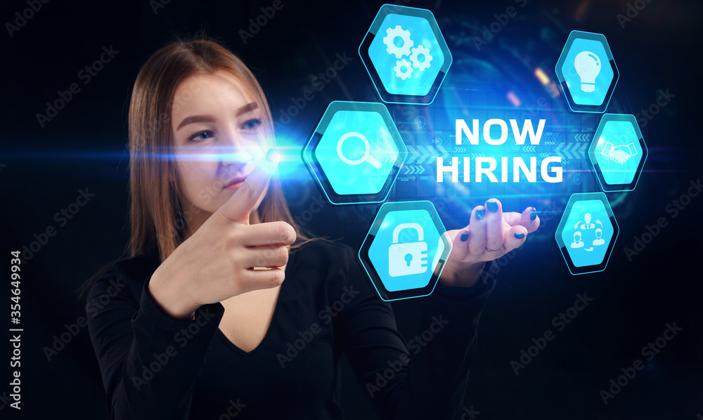 Business, Technology, Internet and network concept. Young businessman working on a virtual screen of the future and sees the inscription: Now hiring Business, Technology, Internet and network concept. Young businessman working on a virtual screen of the future and sees the inscription: Now hiring