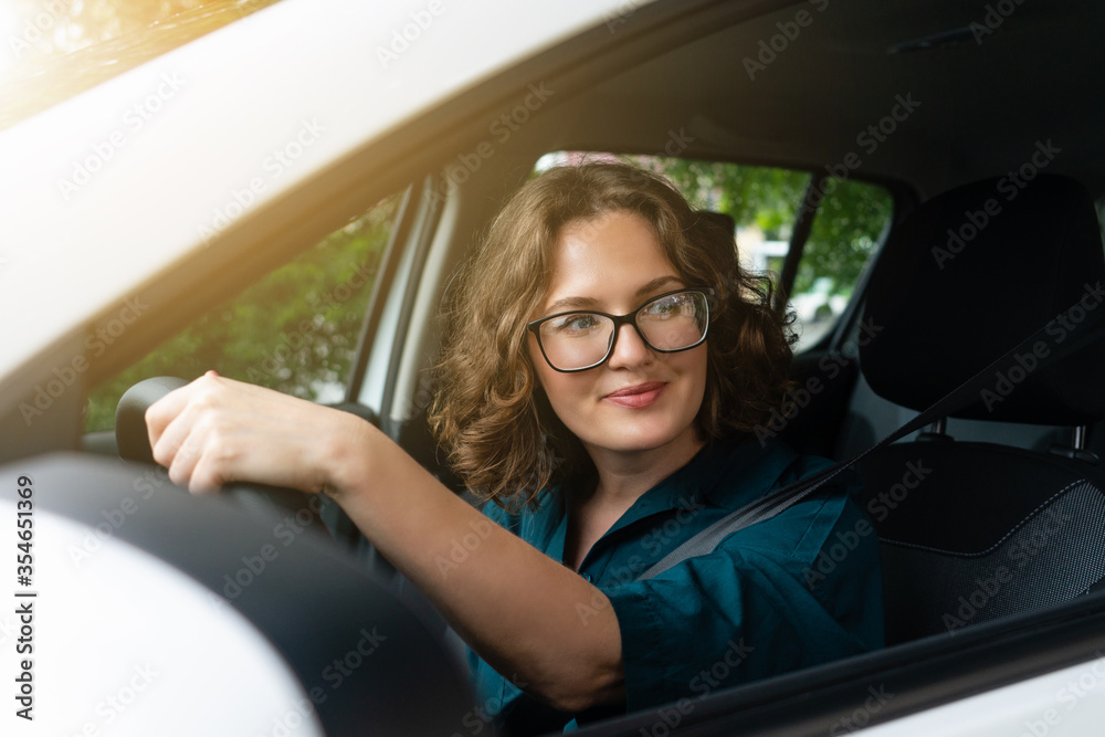 Naklejka premium Woman driver driving a car