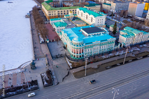 Yekaterinburg, Russia. House of Sevastyanov. Embankment of the city pond. Aerial view after sunset photo