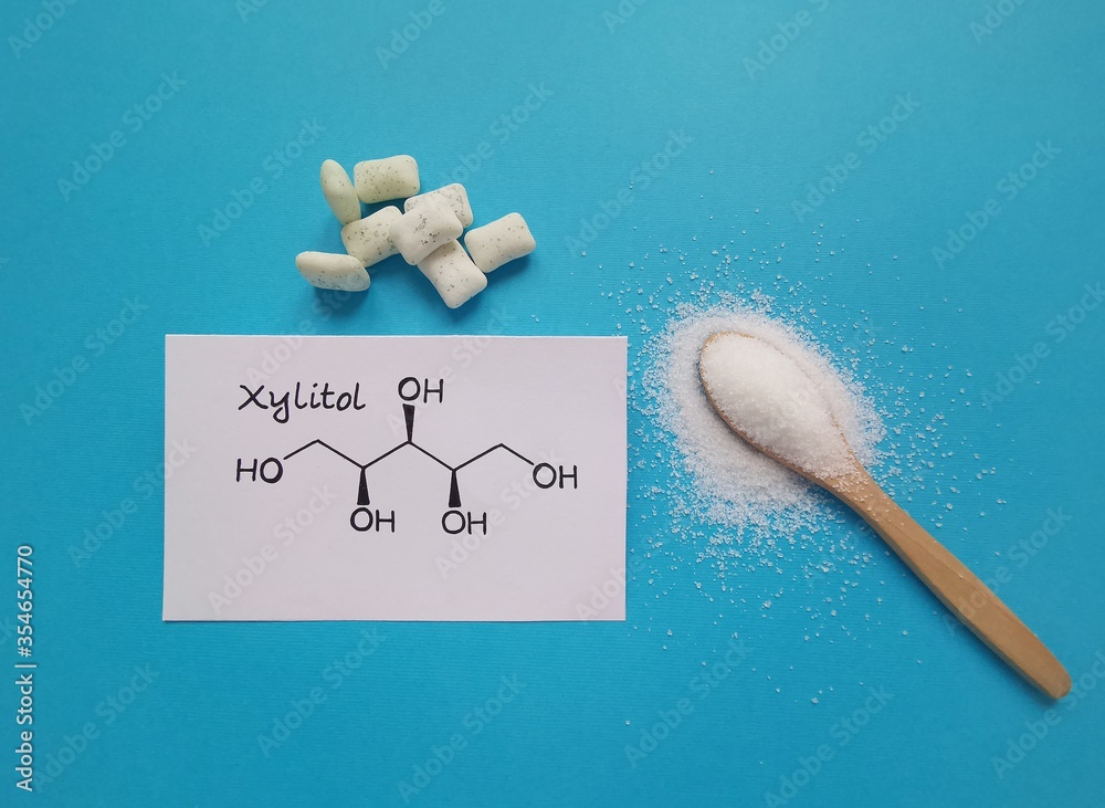 Structural chemical formula of xylitol molecule with chewing gum in the