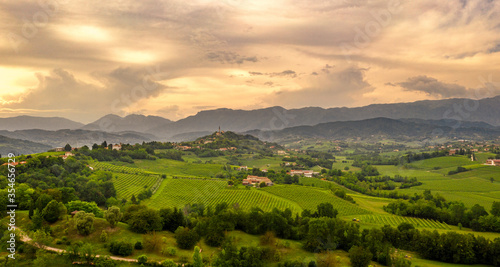 Rural landscape at sunset. Italy mountains, hills and vineyards. panorama. Amazing sky