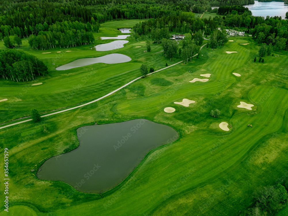Aerial view of green grass at golf course in Finland