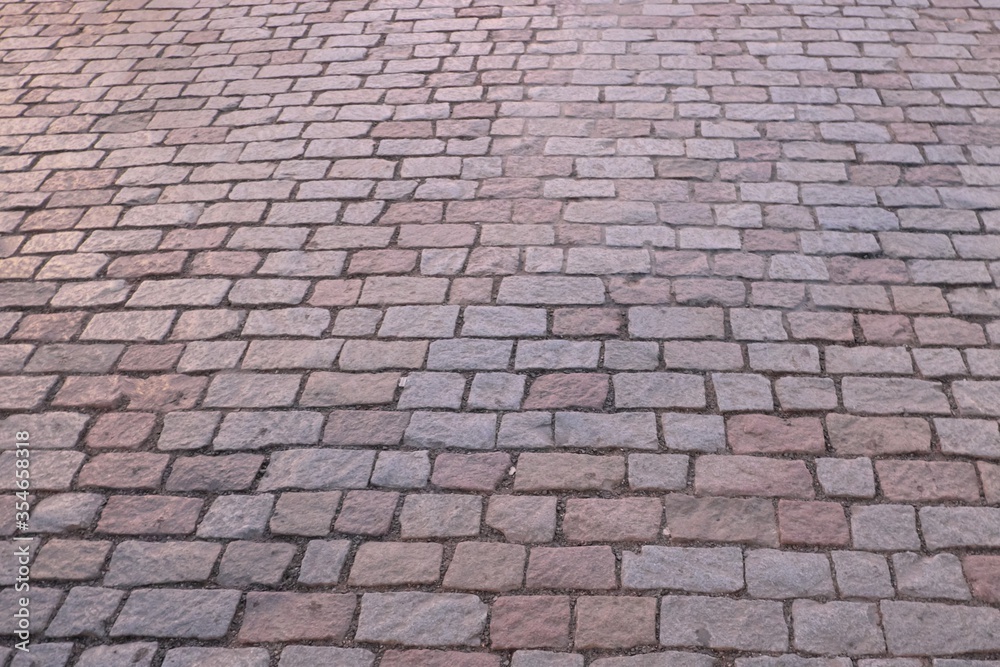 Antique stone pavers as background. Prague pavement. Antique stone pavers as background. Prague pavement.