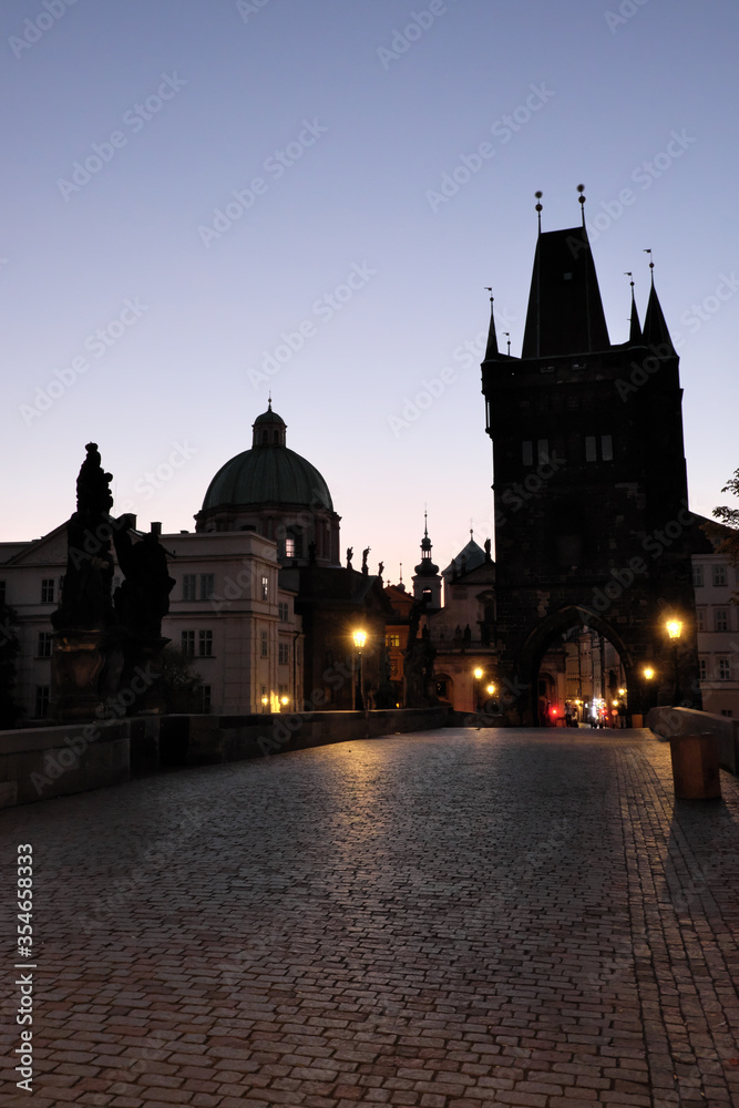 Dawn sky over Charles Bridge in Prague. Ancient architecture at dusk.