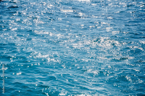 Sea abstract background sunlight on turquoise surface of water