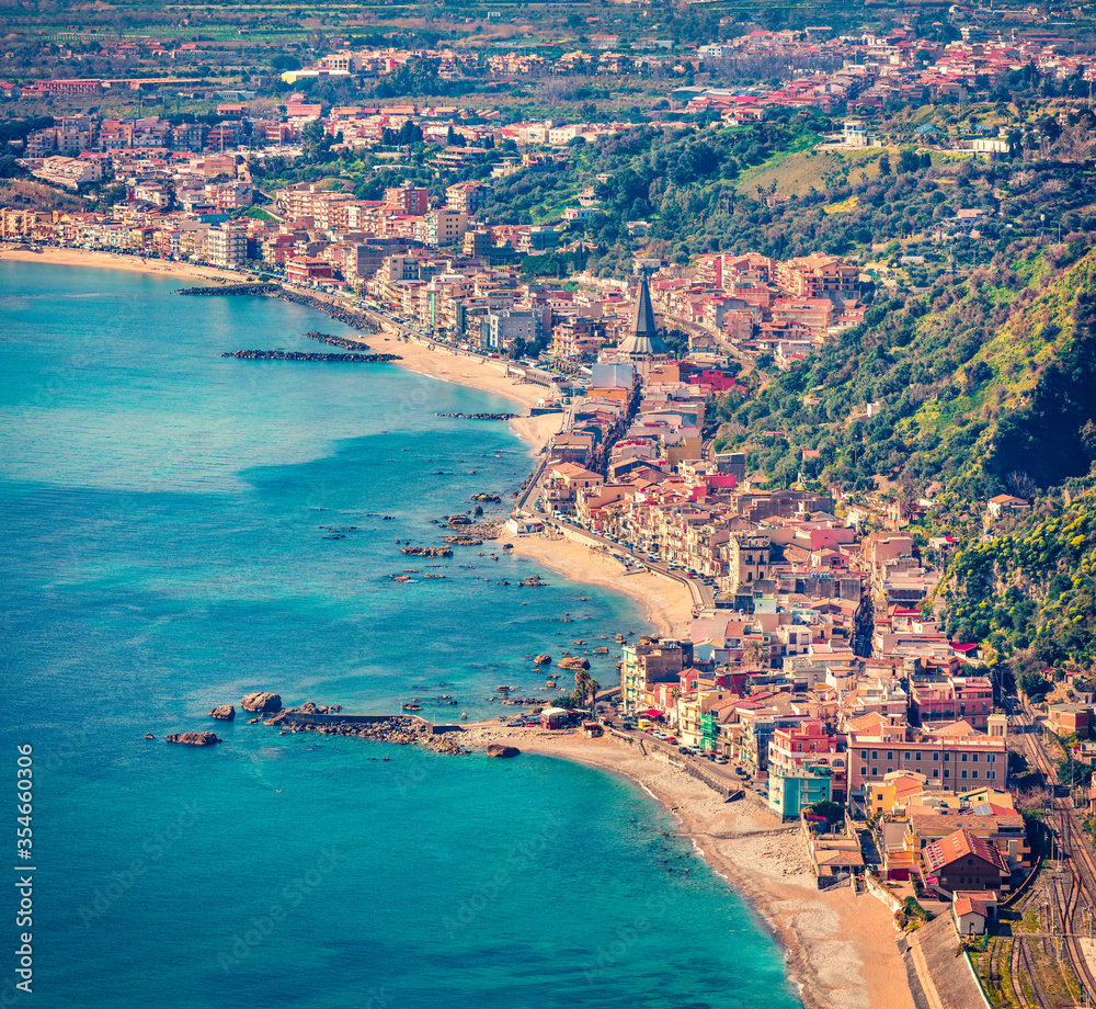 Aerial morning view of Villagonia town, Province of Messina. Stunning summer seascape of Mediterranean sea. Splendid view of Sicily, Italy, Europe.