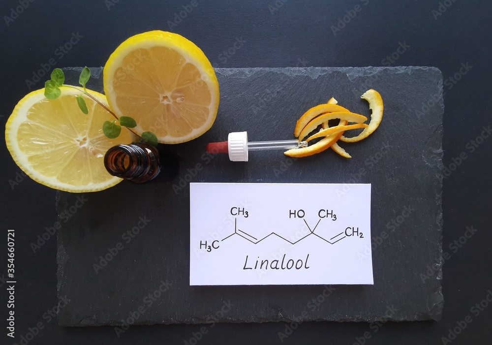 Structural chemical formula of linalool with fresh citrus fruits and a