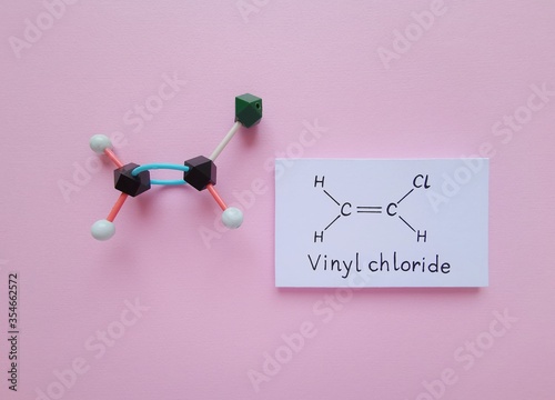 Фотография Molecular structure model and structural chemical formula of vinyl chloride
