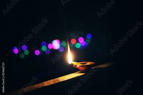 Decorative Clay diya or Oil Lamp lit during festival. Selective focus photo