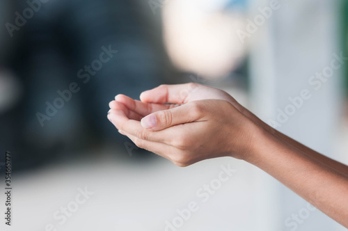 close up of a hand holding something © Tongsai Tongjan