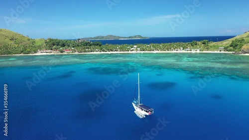 A boat is seen off the coast of Yanuya Island, Fiji. photo