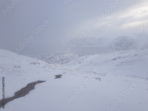 snow covered mountains in blizzard © Arcticphotoworks