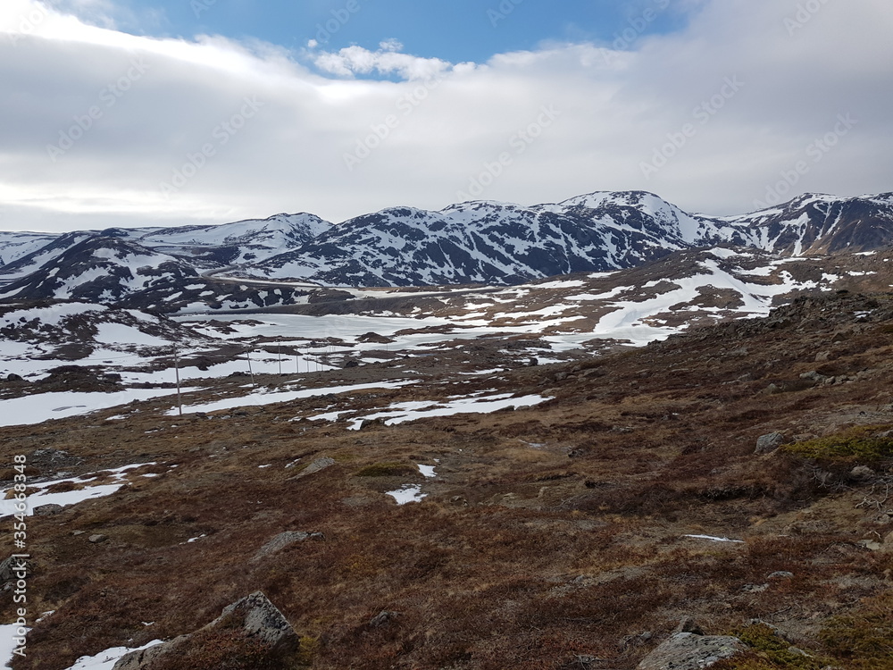 snowy mountain landscape in nordkapp in early spring