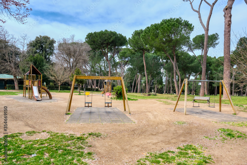 Rome, Italy - March 2020: Empty child's playground in Villa Borghese. Sadness of an empty children's playground, normally very busy with kids playing. Another face of the COVID-19 epidemic in Italy
