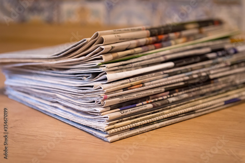 selective focus of the stacking newspapers folded place on wooden table © Dotana