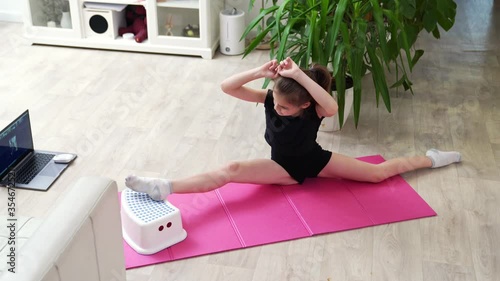girl sports home. gymnastics online. able to do splits. fitness on quarantine