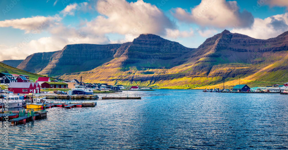 Panoramic summer view of Hvannasund port and village, Vidoy island. Splendid morning seascape of Atlantic ocean. Wonderful landscape of Faroe Islands, Kingdom of Denmark, Europe.