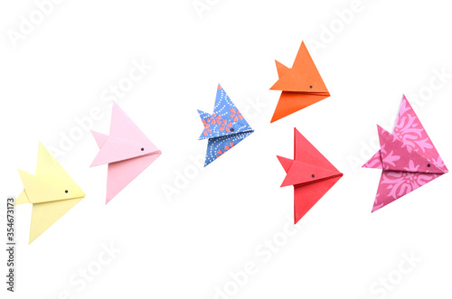 Photography origami paper fishes in leading