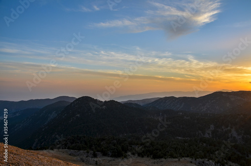 Fototapeta Naklejka Na Ścianę i Meble -  Beautiful mountain landscape with sunset over Taurus Mountains from the top of Tahtali Mountain near Kemer, Antalya, Turkey. 