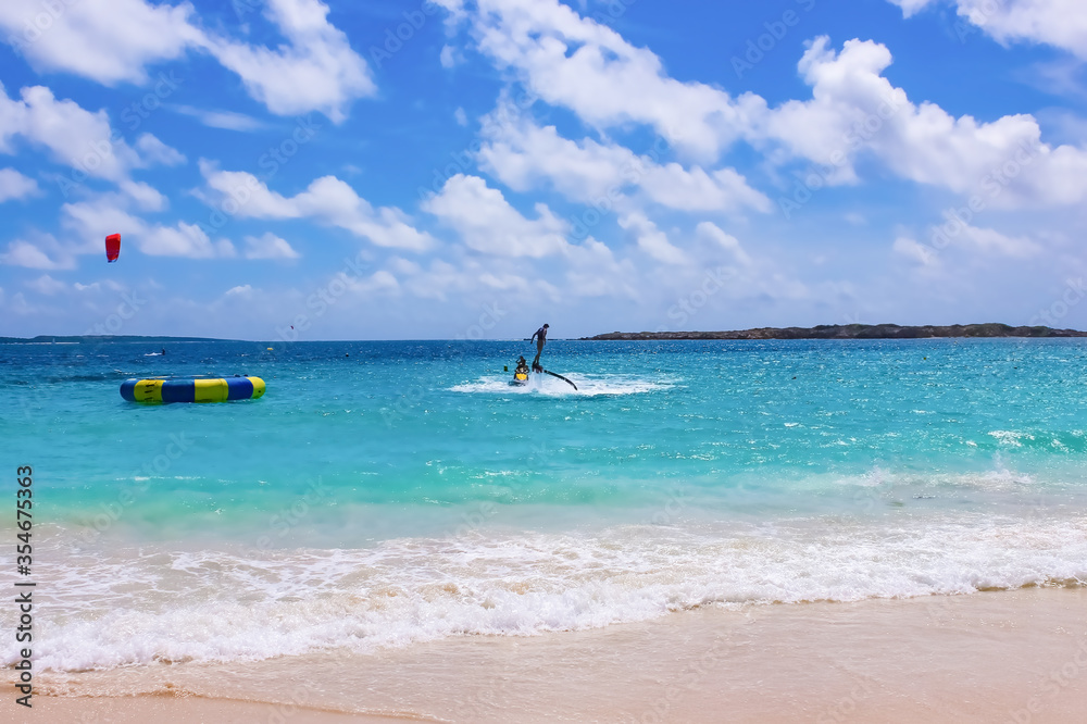 The new flyboard at Caribbean tropical beach The new flyboard at Caribbean tropical beach