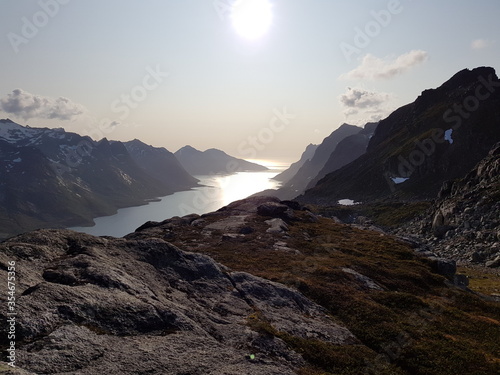 sunset in the mountain fjord valley in northern Norway photo