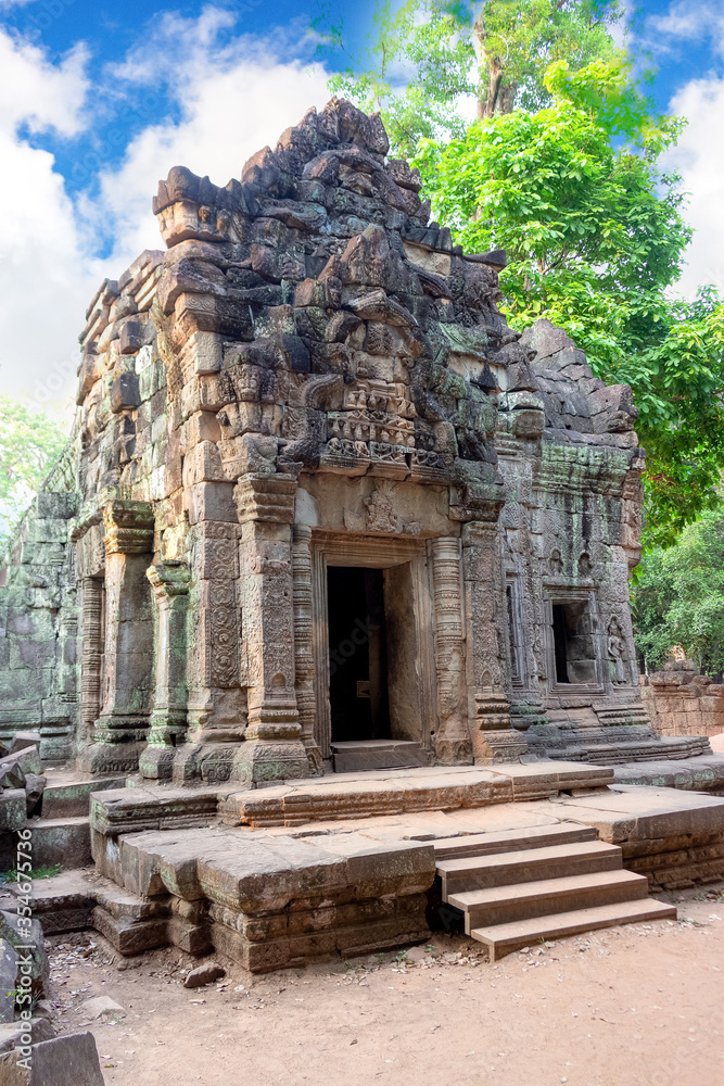 Ta Prohm temple (Tomb raider) at Angkor Wat complex, Siem Reap, Cambodia. Ancient Khmer architecture of Angkor Archaeological Park. UNESCO World Heritage site. Noise visible film grain