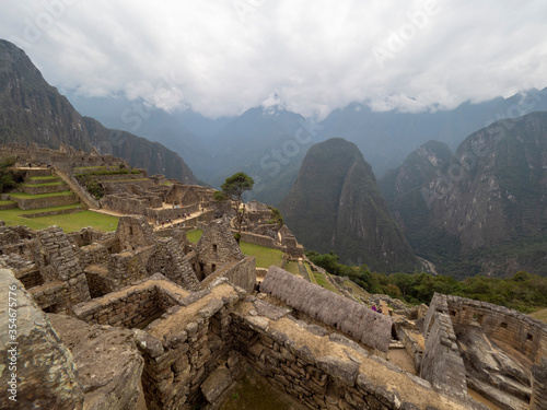 Machupicchu stone buildings view with andes mountains on the background