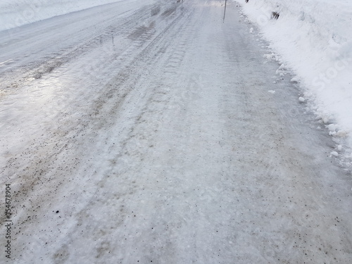 wet slippery ice on public road