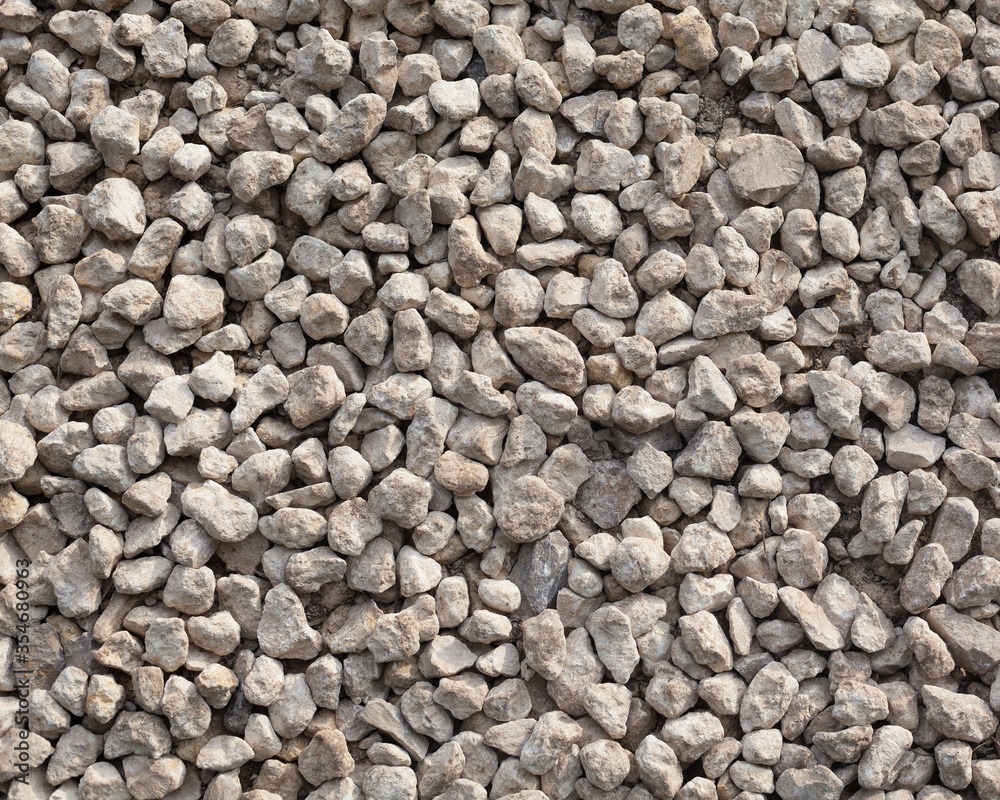 Texture of pale grey gravel. Abstract stones texture