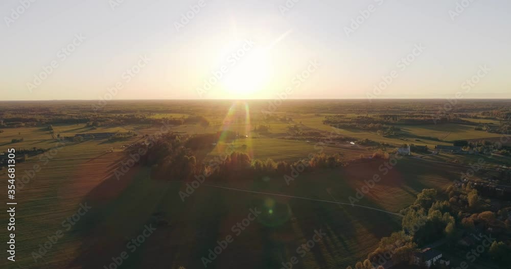 Aerial view of amazing sunset at summer season. Nature landscape. Fields, rivers and trees. Aerial view of amazing sunset at summer season. Nature landscape. Fields, rivers and trees.