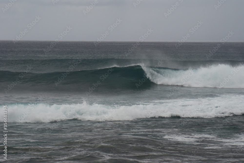 Pacific ocean waves lined up nicely