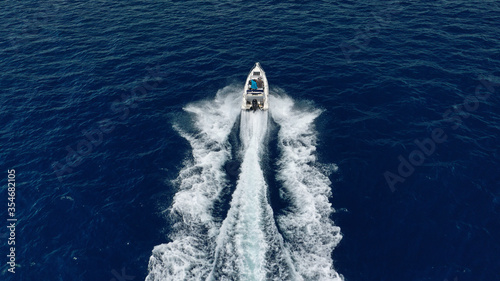 Aerial drone photo of inflatable boat cruising in high speed near Mediterranean port © aerial-drone